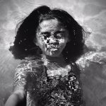 Portrait of a child underwater.