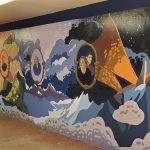 View of a large mural in a school hallway