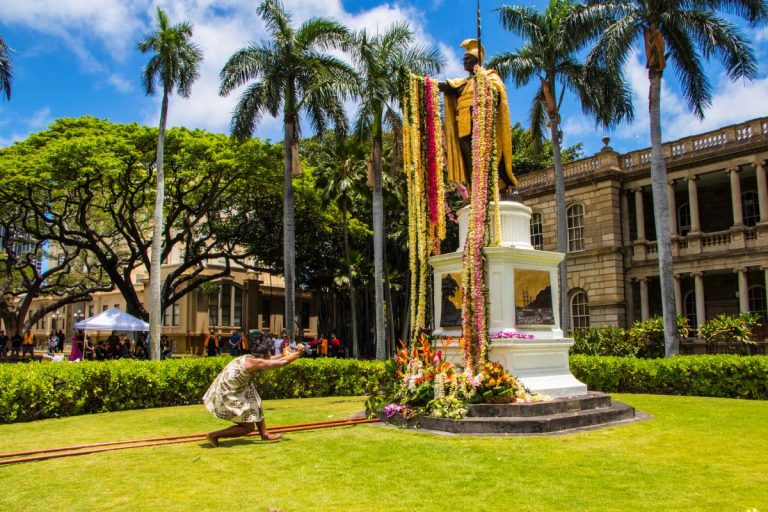 King Kamehameha statue in Honolulu, draped with lei.