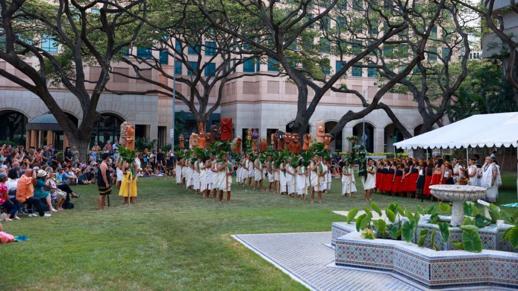 View of audience and ceremony at opening of Ke O Lama at Capitol Modern