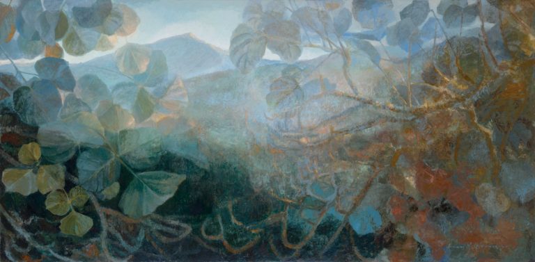 Long horizontal landscape with leaves in foreground and mountain range in background.