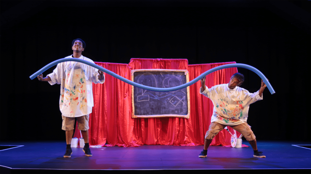 Two performers on a stage