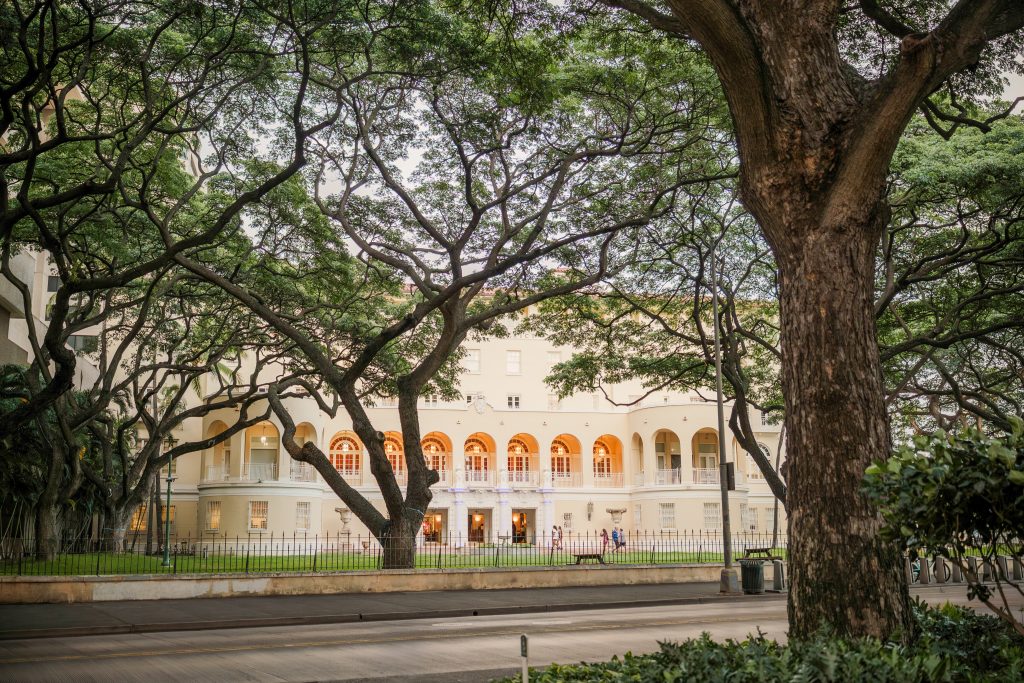 No. 1 Capitol District building viewed from South Hotel Street. Trees are in the foreground and next to the building.