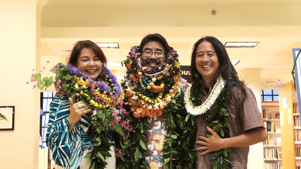 Hawaii Poet Laureates past and present wearing lei and smiling at camera.