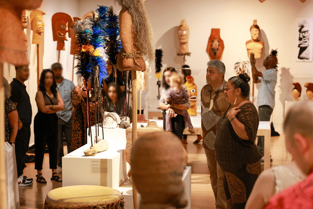 People gathering in a museum gallery.